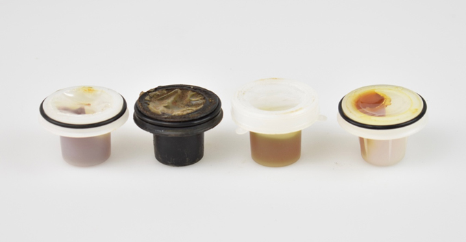 Examples of grease caps from several different encapsulated anchor systems