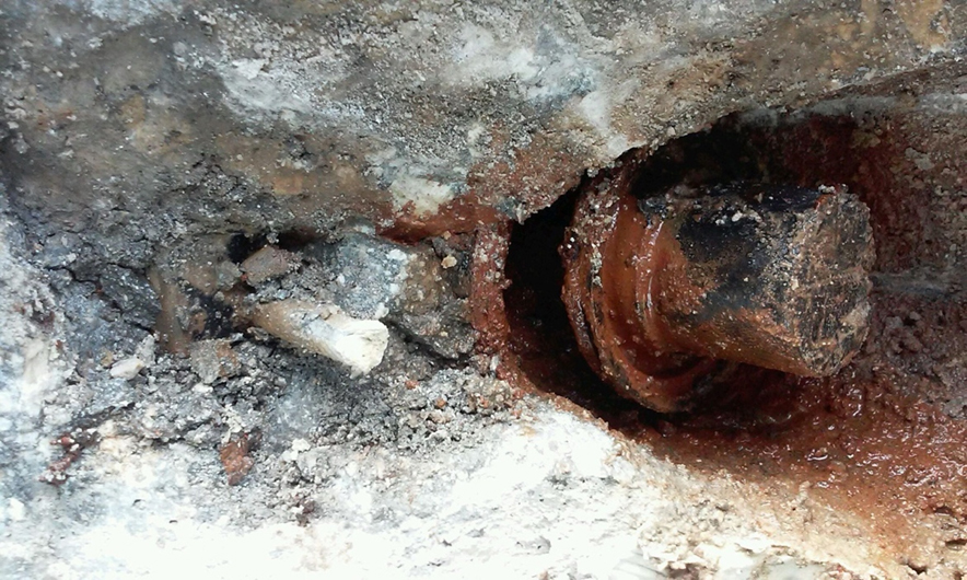 Water leaking from anchor after pocket grout removed